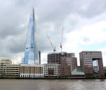 The Shard or Shard London Bridge (formerly known as London Bridge Tower or the Shard of Glass) is a skyscraper in Southwark, London. In late 2007, the gathering uncertainty in the global financial markets sparked concerns about getting the Shard's construction started. The project was almost cancelled, but in January 2008, it was announced that a consortium of Qatari investors had paid £150 million to secure an 80% stake and take control of the project. (Photo by Jesse Toksvig-Stewart/Getty Images)