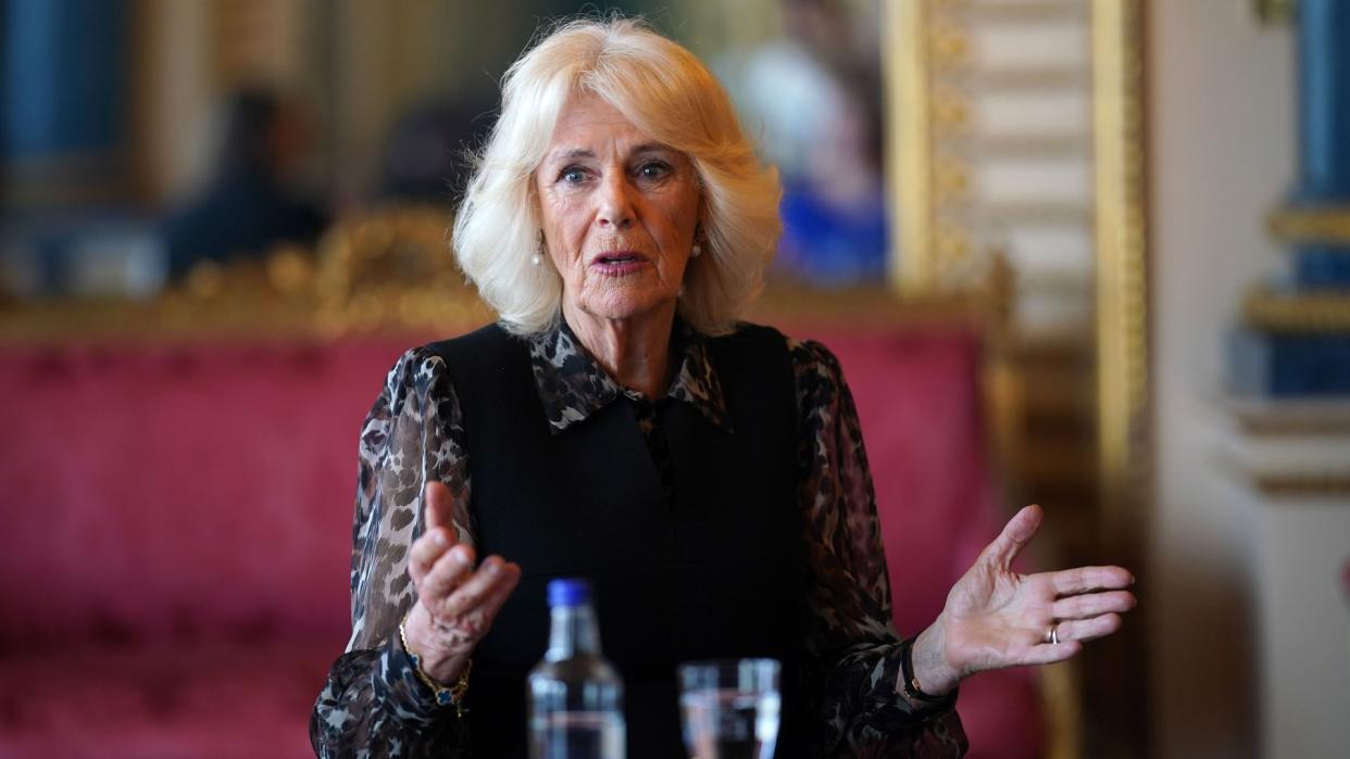 Queen Camilla wearing leopard print dress 