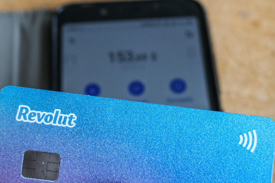 Revolut card in front of Android Revolut mobile app launched on the smartphone is seen in Gdansk, Poland on 9 July 2019  Revolut reached over 400.000 users in Poland this year. The number of Polish clients increased by 100% in 9 months period. Revolut Ltd is a UK financial technology company that offers banking services  (Photo by Michal Fludra/NurPhoto via Getty Images)