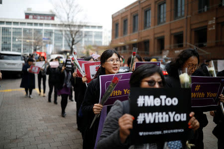 Women march during a protest as a part of the #MeToo movement on International Women's Day in Seoul, South Korea, March 8, 2018. REUTERS/Kim Hong-Ji