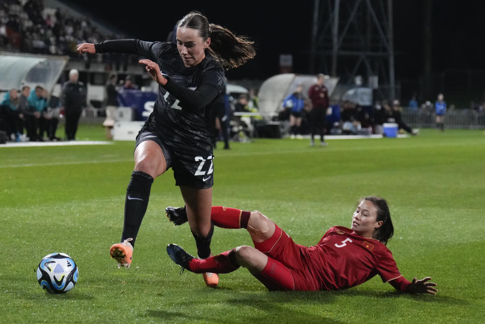 Vietnam's Thi Loan Hoang, right, attempts to stop New Zealand's Milly Clegg during the New Zealand and Vietnam warm up match ahead of the women's World Cup in Napier, New Zealand, Monday, July 10, 2023. (AP Photo/John Cowpland)