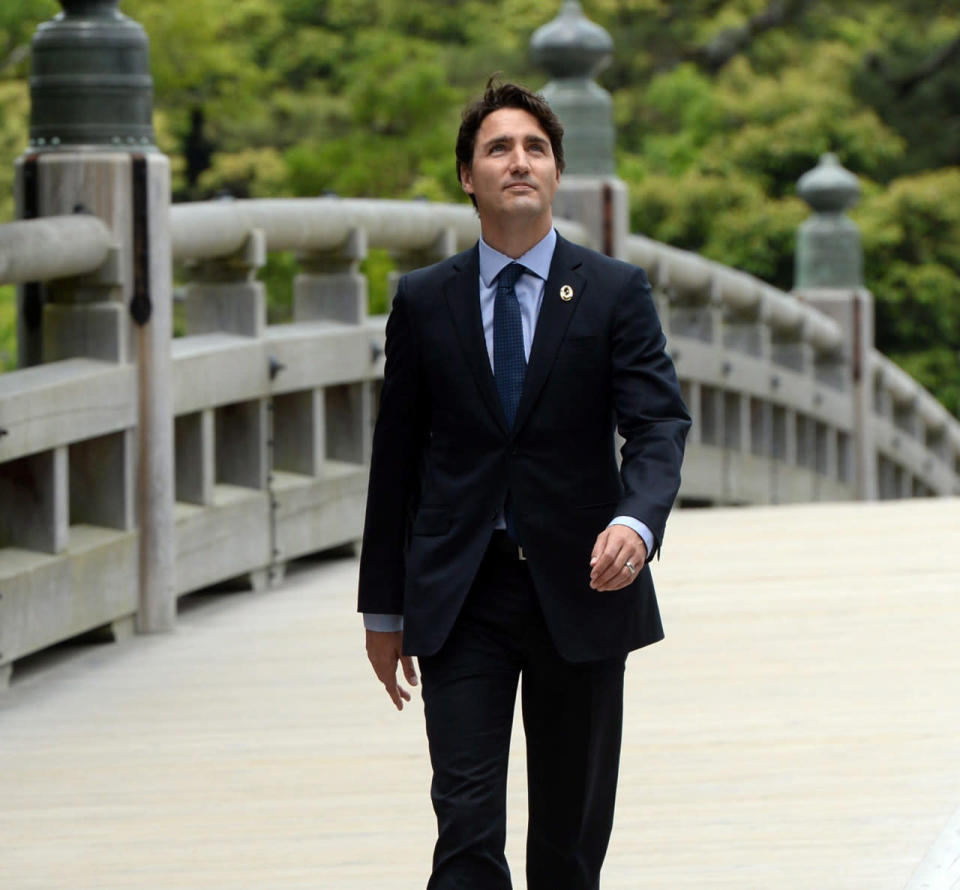 Prime Minister Justin Trudeau arrives to the Ise Grand Shrine (Ise Jingu) in Ise, Japan during the G7 Summit on Thursday, May 26, 2016. THE CANADIAN PRESS/Sean Kilpatrick