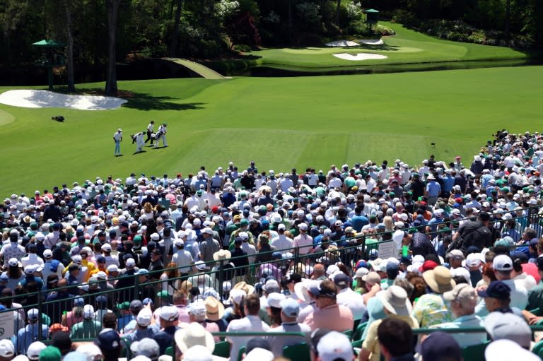 The crowds at Augusta National flocked to watch Tiger Woods on Friday as he made the cut for a record 24th time at the Masters. (Warren Little)