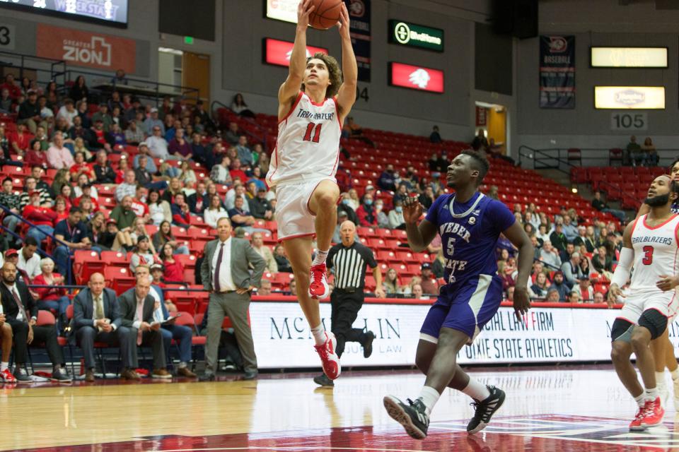 Dixie State freshman Noa Gonsalves goes to the basket as the Trailblazers drop one to an undefeated Weber State team 87-70 at Burns Arena on Saturday, Nov. 27, 2021.