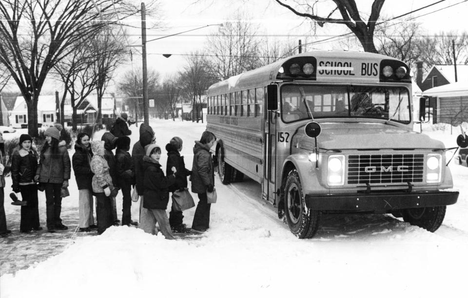 Students on Detroit's east side line up outside Wayne Elementary School for the bus that would take them to their middle school some miles away on Jan. 19, 1976.