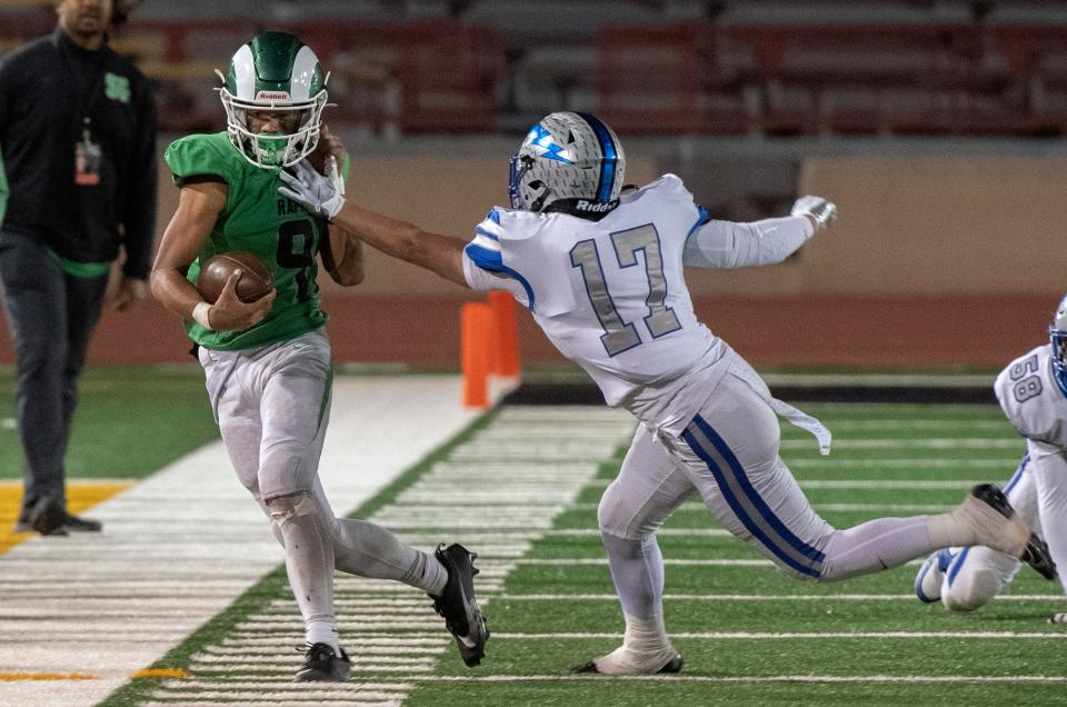 St.Mary's Samson Hunkin, left, is pushed out of bounds by Rocklin's Tyler Ward during the Sac-Joaquin Section Division II football championship game at Hughes Stadium in Sacramento on Nov. 25, 2023. Rocklin won 17-6.