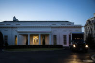 <p>A moving truck departs the West Wing of the White House at dawn. </p>
