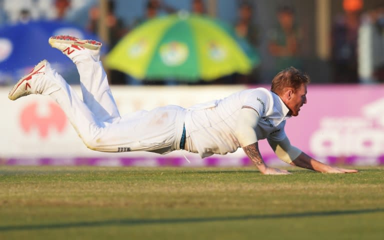 England's Ben Stokes dives to stop the ball during their first Test match against Bangladesh, at Zahur Ahmed Chowdhury Cricket Stadium in Chittagong, on October 23, 2016