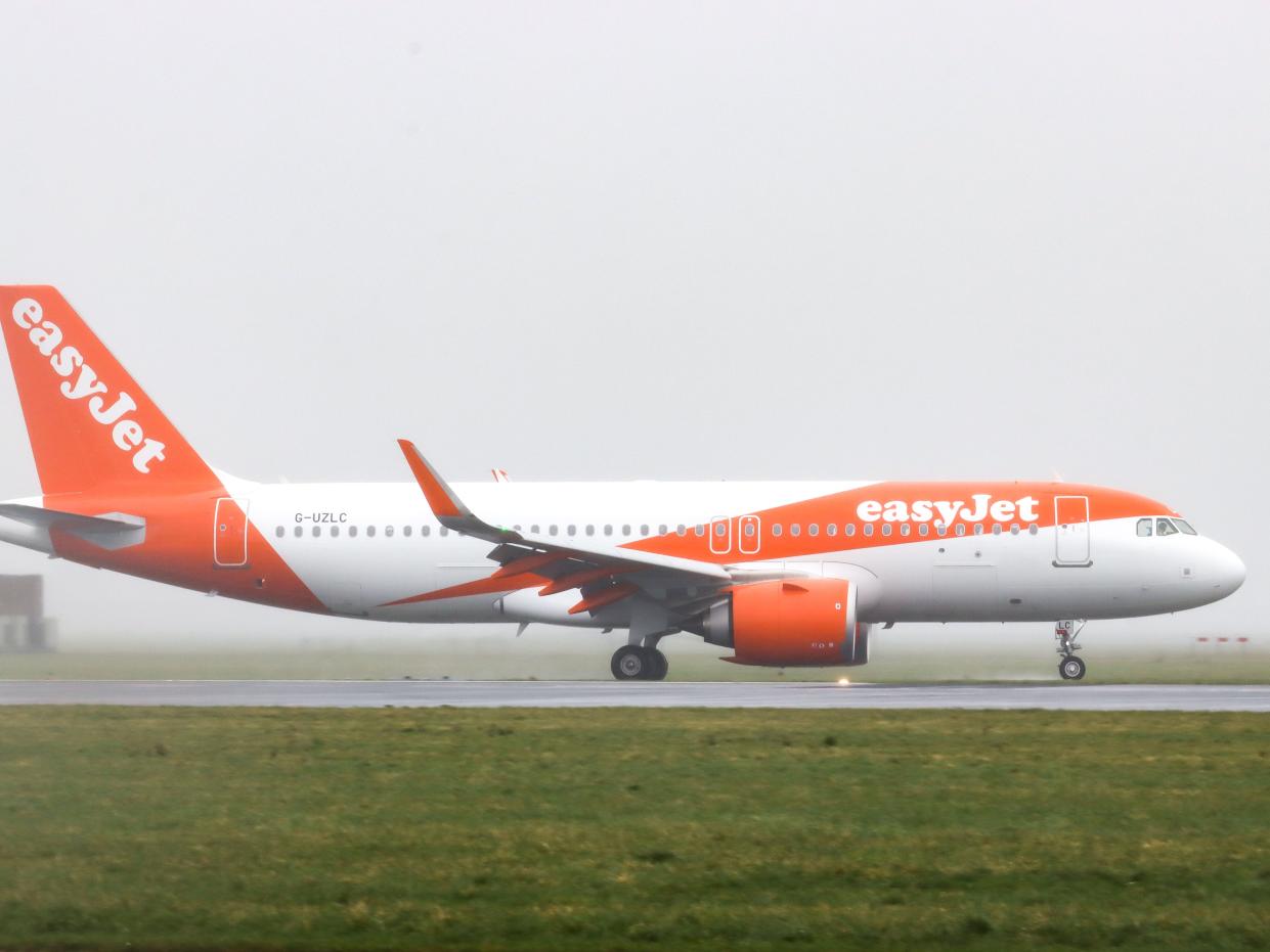 Easyjet A320 plane on a runway.