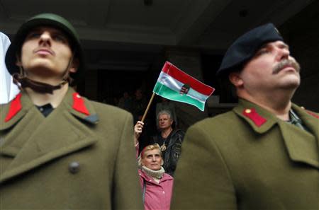 Right-wing nationalists attend a ceremonial unveiling the statue of wartime leader Miklos Horthy in central Budapest November 3,2013. REUTERS/Laszlo Balogh