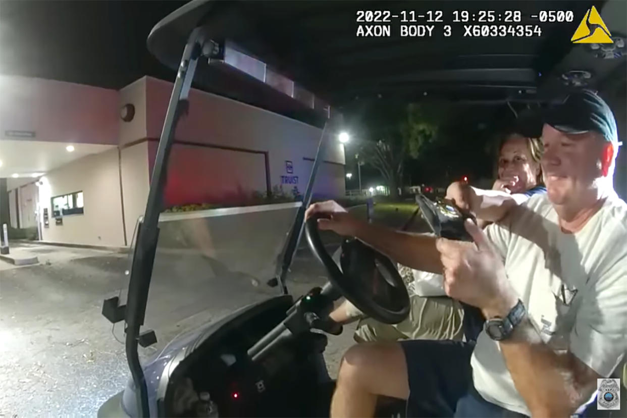 Tampa Police Chief Mary O’Connor in a golf cart driven by her husband in Oldsmar, northwest of Tampa, on Nov. 12. (Tampa PD via YouTube)