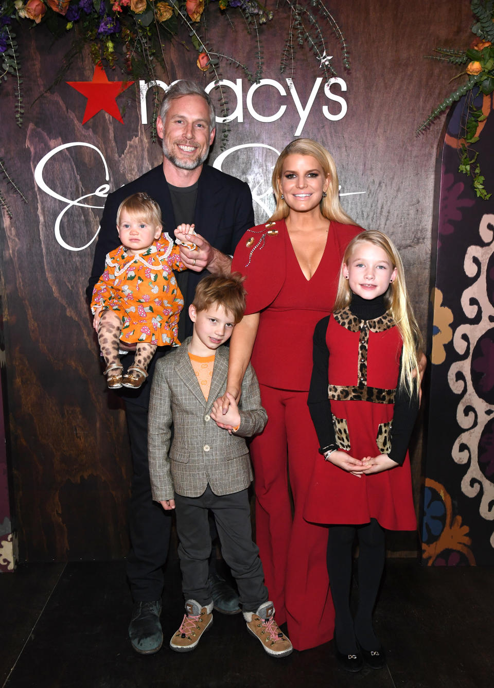 Jessica Simpson poses with Eric Johnson, Birdie Mae Johnson, Ace Knute Johnson and Maxwell Drew Johnson during a celebration of her memoir 