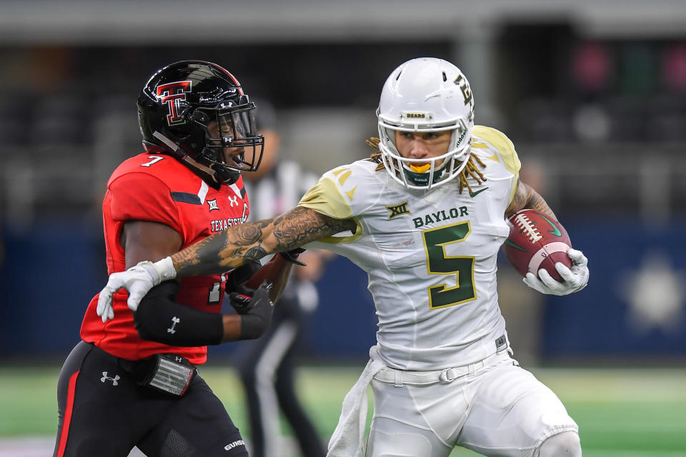 LUBBOCK, TX - NOVEMBER 24: Wide receiver Jalen Hurd #5 of the Baylor Bears tries to get past defensive back Jah'Shawn Johnson #7 of the Texas Tech Red Raiders during the first half of the game on November 24, 2018 at  AT&T Stadium in Arlington, Texas. (Photo by John Weast/Getty Images)