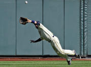 Kent State center fielder Evan Campbell leaps and catches a fly ball hit by Florida's Brian Johnson in the sixth inning of an NCAA College World Series elimination baseball game in Omaha, Neb., Monday, June 18, 2012. (AP Photo/Eric Francis)