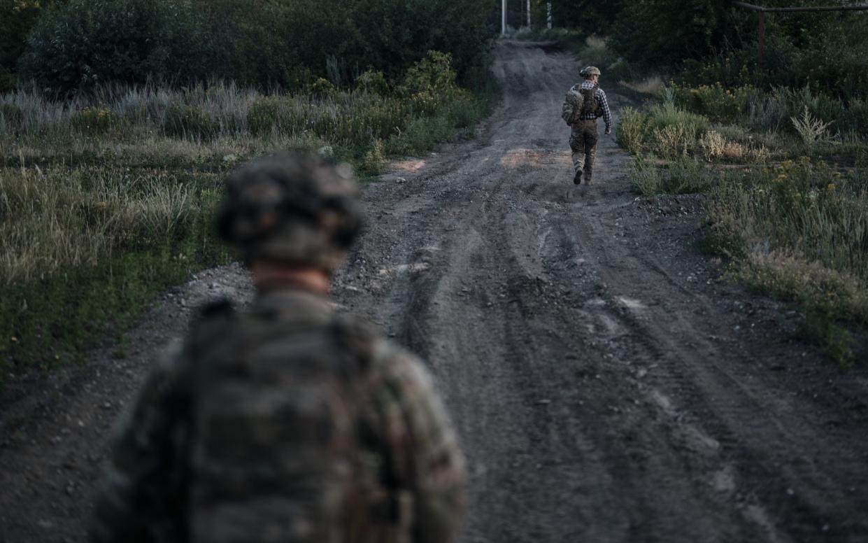 Ukrainian soldiers on the outskirts of Chasiv Yar - a day before it announced its troops were withdrawing