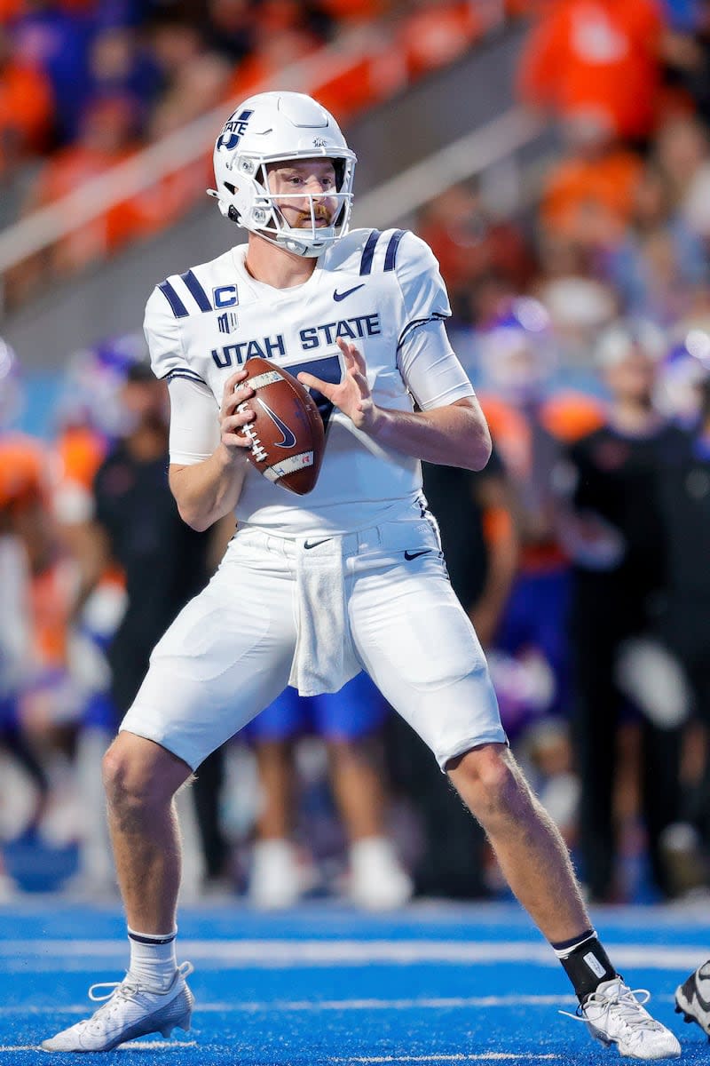 Utah State quarterback Spencer Petras (7) looks down field against Boise State in the second half of an NCAA college football game, Saturday, Oct. 5, 2024, in Boise, Idaho. Boise State won 62-30. (AP Photo/Steve Conner) | Steve Conner