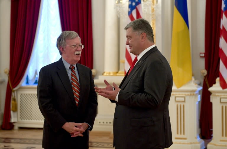This handout photograph released by the Ukrainian presidency shows President Petro Poroshenko (R) speaking with US National Security Advisor John Bolton (L) who is visitng Kiev