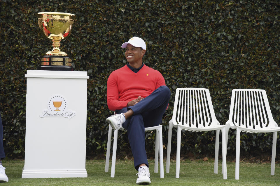 USA team captain Tiger Woods waits for a photo shoot ahead of the President's Cup Golf tournament in Melbourne, Australia, Wednesday, Dec. 11, 2019. (AP Photo Andy Brownbill)