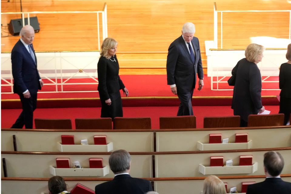 President Joe Biden, left, First Lady Jill Biden, former President Bill Clinton, and former First Lady Hillary Clinton, right, arrive to attend a tribute service for former First Lady Rosalynn Carter.