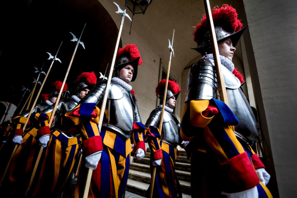 <p>New Vatican Swiss Guards recruits prepare to swear in during a ceremony at St. Damaso courtyard on May 6, 2018 in Vatican City, Vatican. The annual swearing in ceremony for the New Papal Swiss Guards takes place every year on May 6, commemorating the 147 soldiers who died defending Pope Clement VII on the same day in 1527 during the sack of Rome. This year 33 new recruits joined the military unit whose responsibility is to protect the Pope. (Photo from Alessandra Benedetti/Corbis via Getty Images) </p>