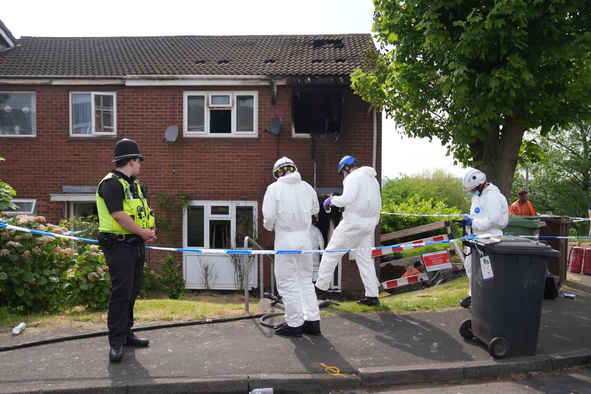 Forensic officers at the scene of a house fire in Wolverhampotn where two people died on Saturday morning (Jacob King/PA Wire)