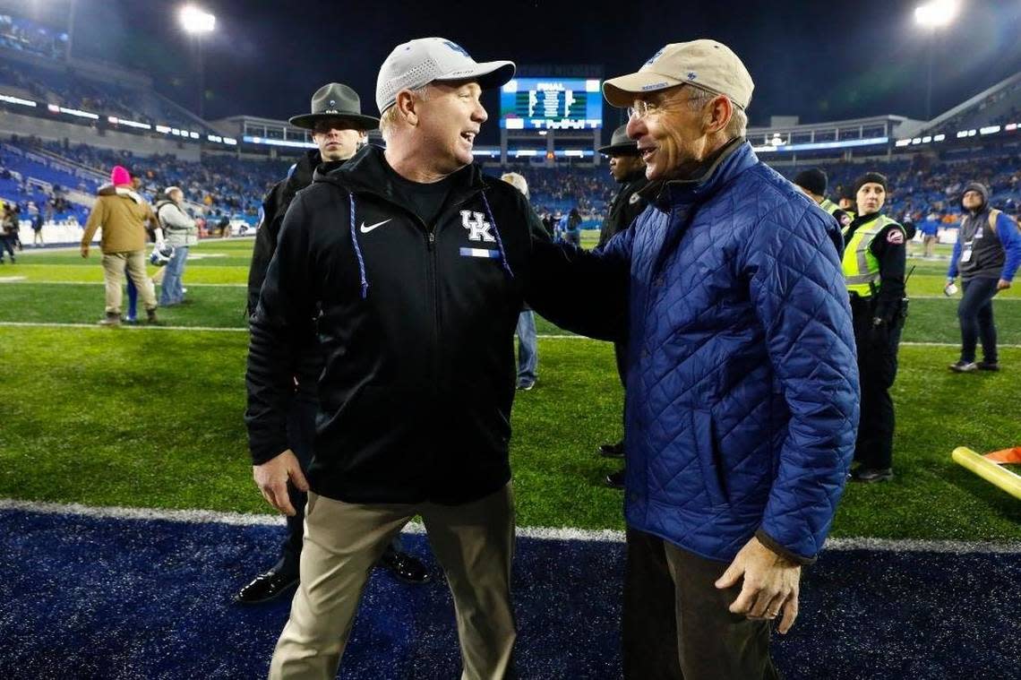 University of Kentucky President Eli Capilouto, right, congratulated Wildcats football coach Mark Stoops, left, after a victory at Kroger Field.