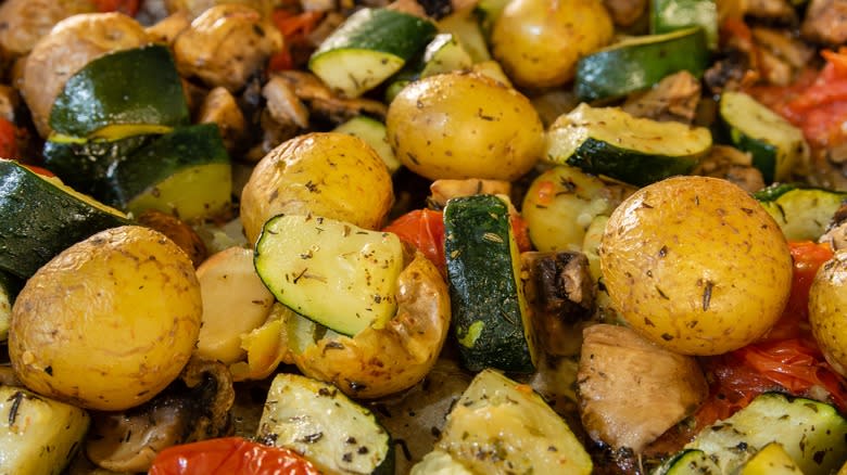 Potatoes roasted with mushrooms, zucchini, tomato
