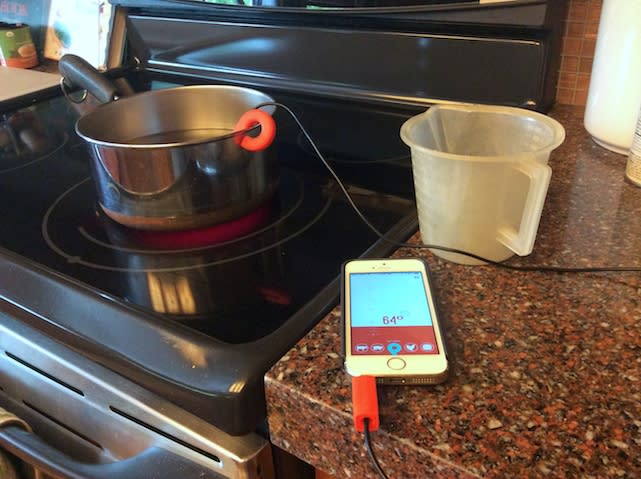 Range Ember smart thermometer in use on a stove