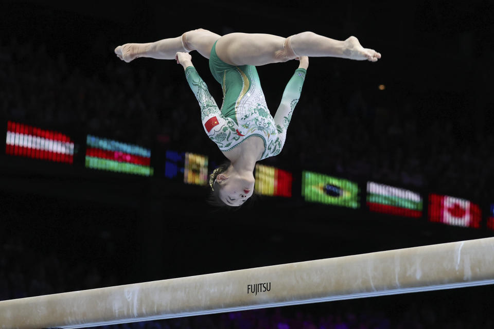 China's Zhou Yaqin competes on the beam during the apparatus finals at the Artistic Gymnastics World Championships in Antwerp, Belgium, Sunday, Oct. 8, 2023. (AP Photo/Geert vanden Wijngaert)