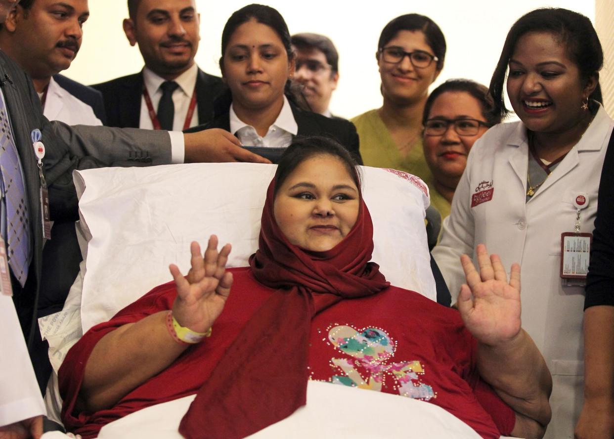 Eman Ahmed Abd El Aty waving during a press conference at the Burjeel Hospital in Abu Dhabi: AFP/Getty Images