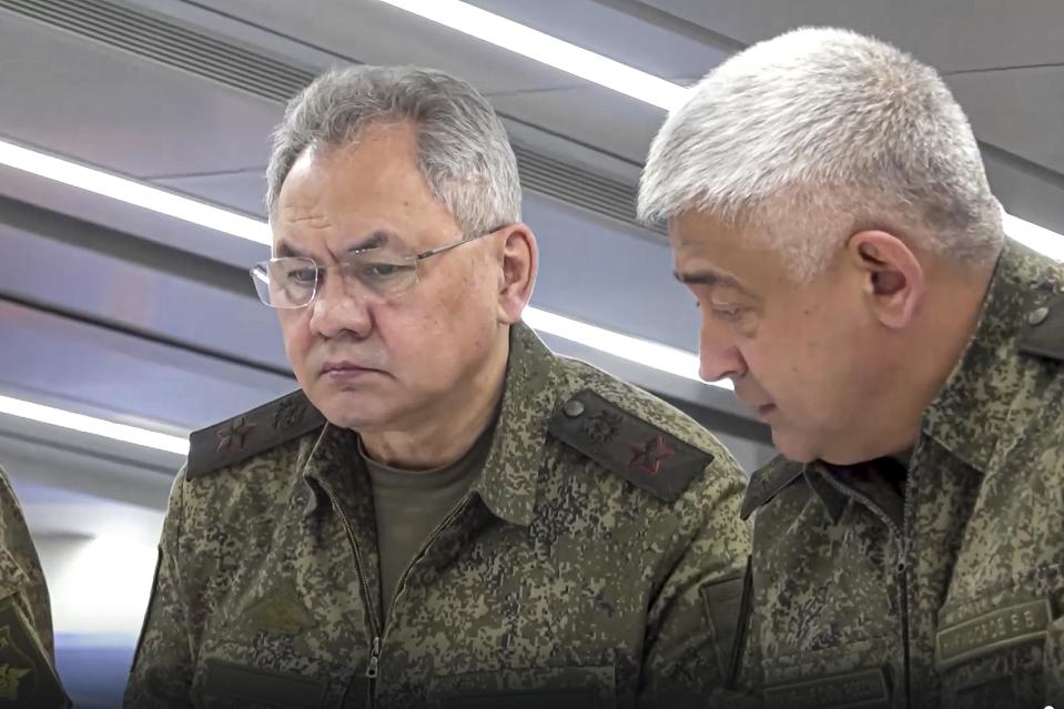 In this photo taken from video released on Monday, June 26, 2023 by the Russian Defense Ministry Press Service, Russian Defense Minister Sergei Shoigu, left, and Yevgeny Nikiforov, the commander of the Western Military District inspect a command post of one of the formations of the Zapad (West) group of Russian troops at an undisclosed location of Ukraine. Shoigu made his first public appearance Monday since a mercenary uprising demanded his ouster, inspecting troops in Ukraine. (Russian Defense Ministry Press Service via AP)