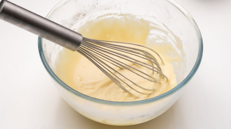 mixing crepe batter in bowl