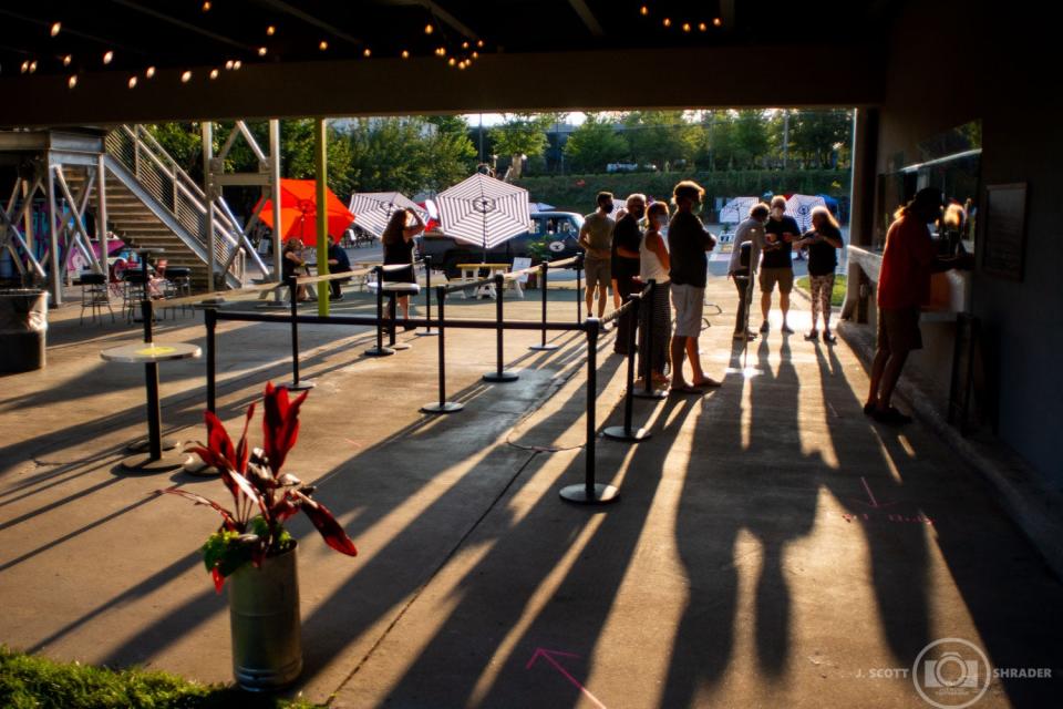 Customers stand in a beer line at Rabbit Rabbit.