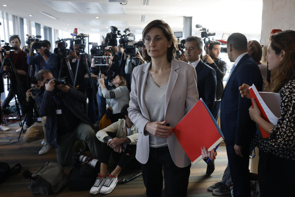 Sports Minister Amélie Oudéa-Castéra, center, followed by French Interior Minister Gerald Darmanin arrives for a press conference following a meeting on security after incidents during the Champions League final Saturday at the State France stadium, Monday, May 30, 2022 in Paris. The British government says it's deeply concerned over the treatment of Liverpool supporters by French authorities, who blamed fans for unrest at the Champions League final amid overcrowding outside the Stade de France. (AP Photo/Jean-Francois Badias)