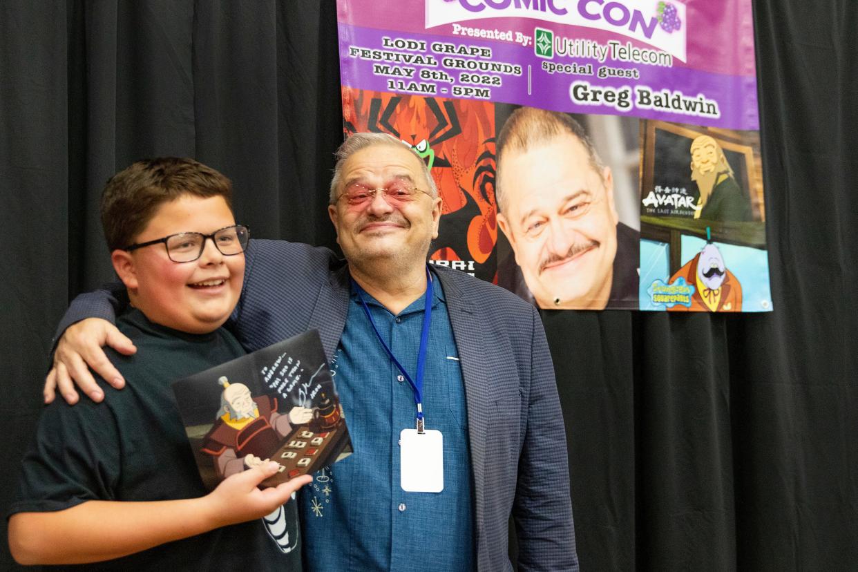 Andrew Hilbert, 10, is all smiles after meeting and getting is autograph from his favorite 'Avatar: the Last Airbender' voice actor, Greg Baldwin, at the Lodi Comic Con at Lodi Grape Festival on May 8th. Dianne Rose/For The Record