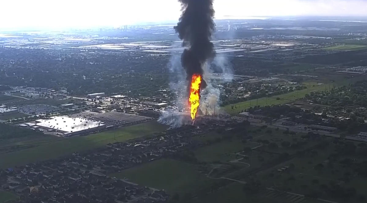 A pipeline explosion sends a huge column of fire over Houston’s suburbs