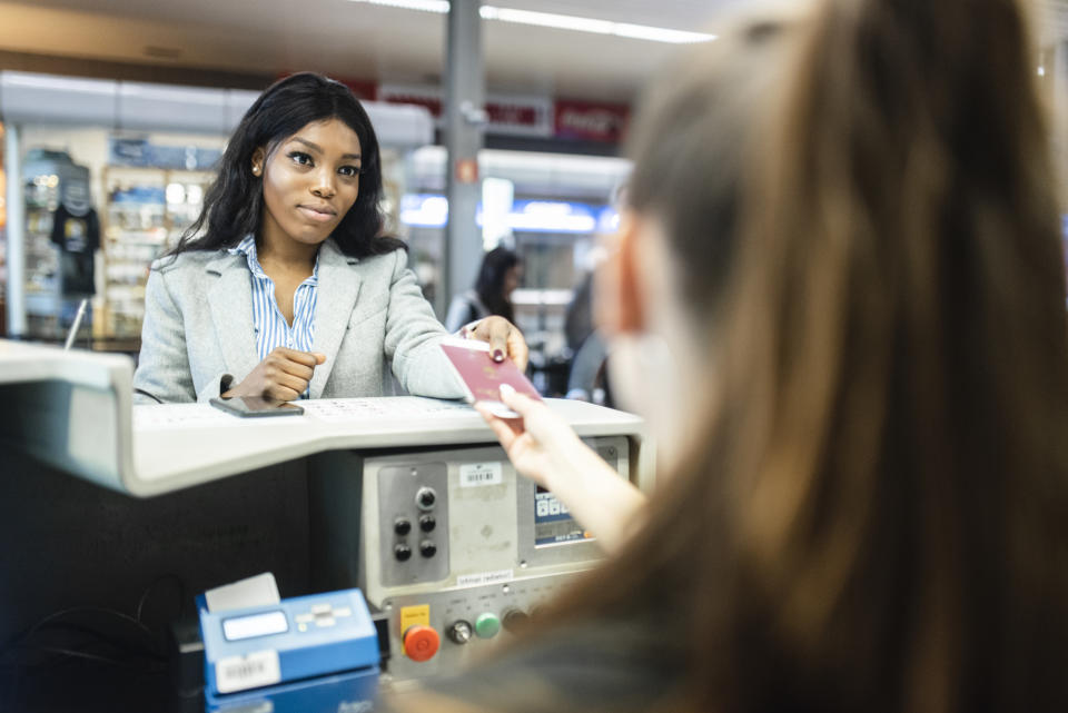 Woman checking in. (Getty Images)