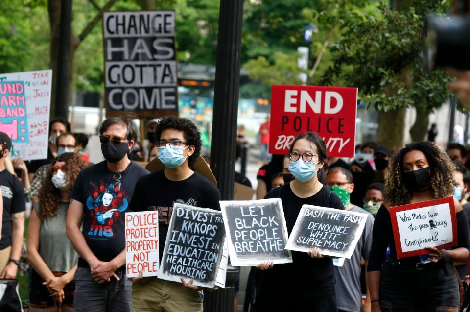 Protesters in Providence's Burnside Park support a call to defund the police in June 2020 amid the civil unrest that swept the country following the murder of George Floyd.