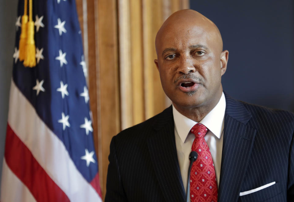 FILE - In this July 9, 2018, file photo, Indiana Attorney General Curtis Hill speaks during a news conference at the Statehouse in Indianapolis. The four women who accused Indiana's attorney general of drunkenly groping them at a party are holding a news conference with their lawyers. The law firm representing the women says an announcement is coming Tuesday, June 18, 2019, about legal action regarding the allegations against Hill. The women’s lawyers said in October they intended to sue Hill, who has denied wrongdoing. (AP Photo/Michael Conroy, File)