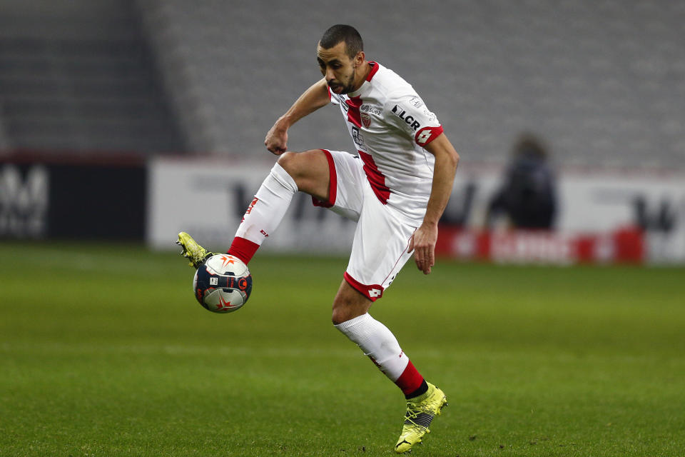 Dijon's Fouad Chafik controls the ball during the French League One soccer match between Lille and Dijon at the Stade Pierre Mauroy stadium in Villeneuve d'Ascq, northern France, Sunday, Jan. 31, 2021. (AP Photo/Michel Spingler)