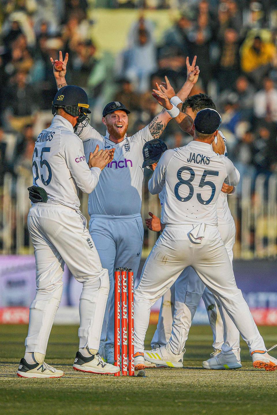 England’s Ben Stokes celebrates with teammates after the dismissal of Pakistan’s Haris Rauf (AFP via Getty Images)