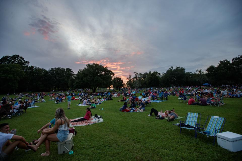 Hundreds gather at Tom Brown Park to hear the Tallahassee Symphony Orchestra and watch a fireworks show Sunday, July 4, 2021.