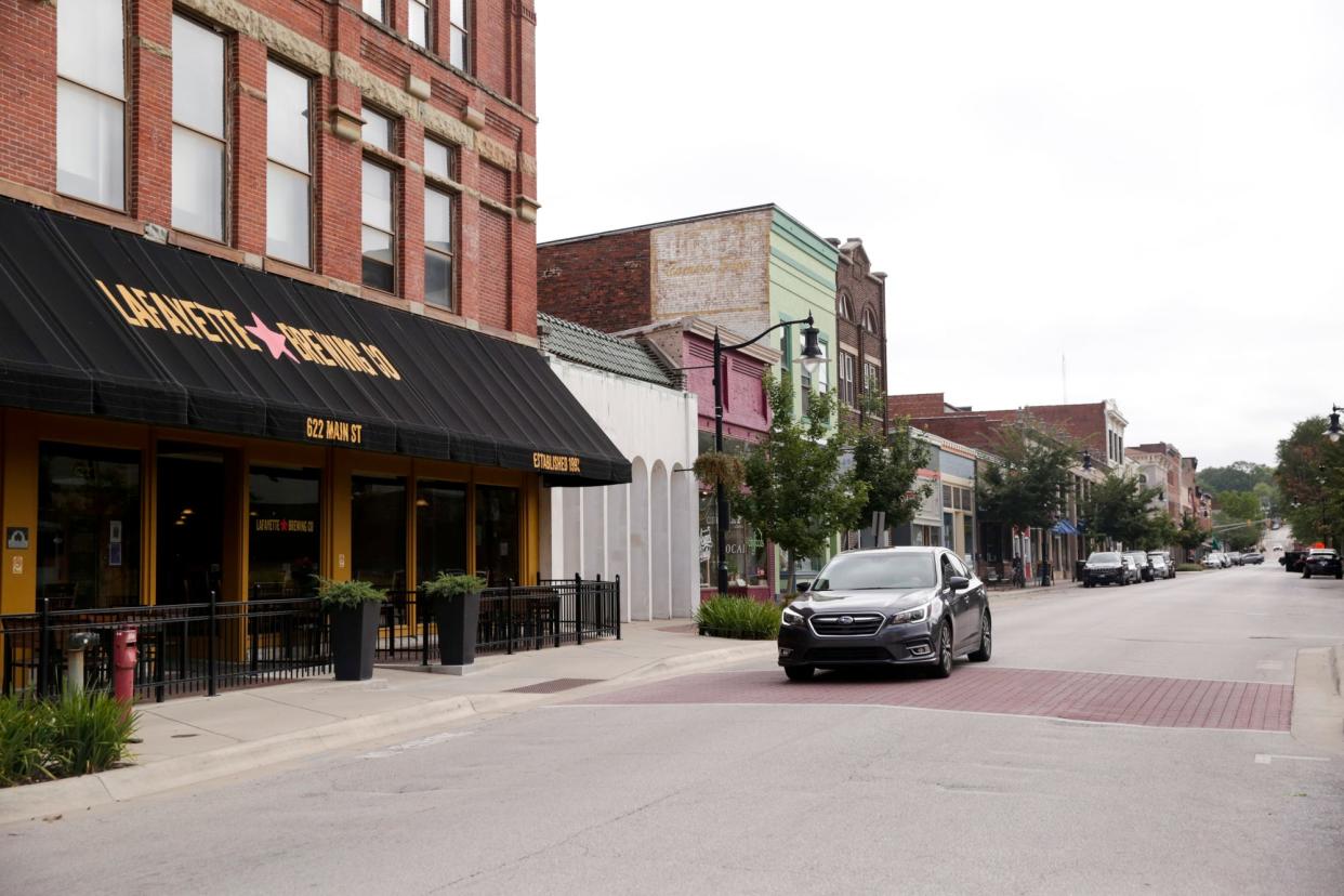 A car drives along Main Street past Lafayette Brewing Co., Tuesday, Aug. 11, 2020 in Lafayette.