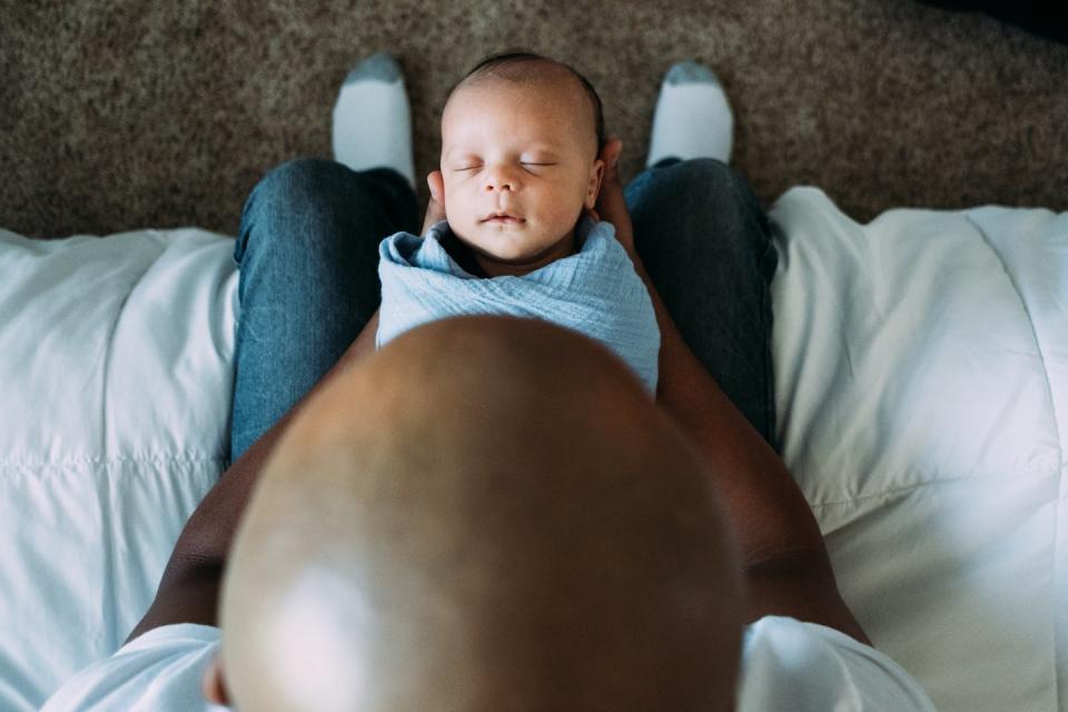 Scientists are interested in what spending more time with a newborn means for a father’s brain. <a href="https://www.gettyimages.com/detail/photo/newborn-baby-sleeping-in-fathers-arms-royalty-free-image/1263047151" rel="nofollow noopener" target="_blank" data-ylk="slk:Cavan Images via Getty Images;elm:context_link;itc:0;sec:content-canvas" class="link ">Cavan Images via Getty Images</a>