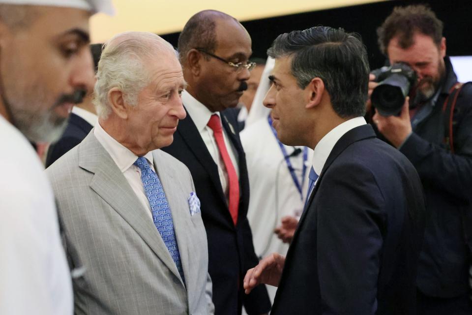 King Charles III (left) speaks with prime minister Rishi Sunak as they attend the opening ceremony of the World Climate Action Summit (PA)