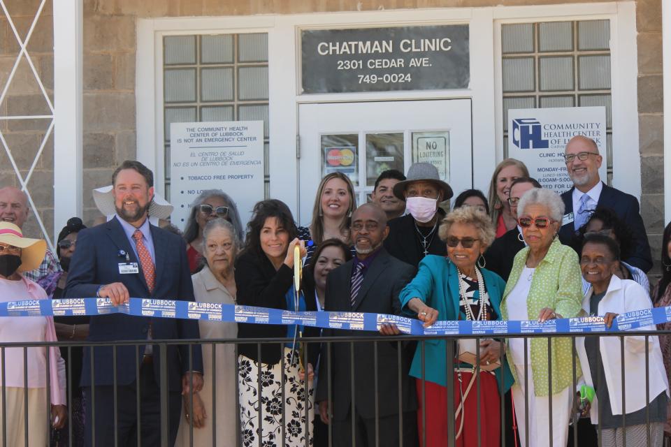 Members of the community, UMC and CHCL gather to cut the ribbon and unveil the updated Chatman Clinic.