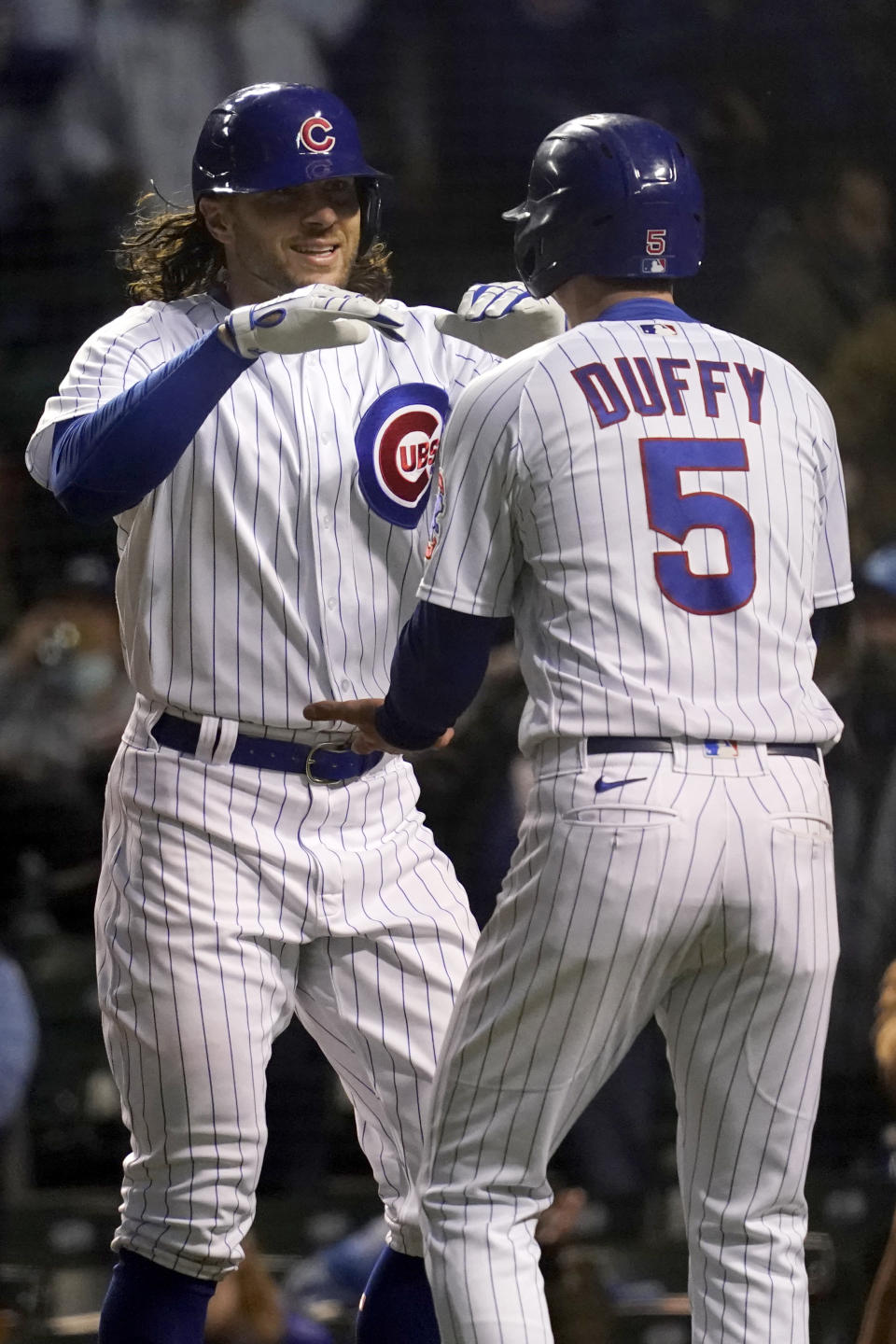 Chicago Cubs' Jake Marisnick, left, celebrates with Chicago Cubs' Matt Duffy after his two-run home run during the fifth inning of a baseball game against the Los Angeles Dodgers in Chicago, Wednesday, May 5, 2021. (AP Photo/Nam Y. Huh)