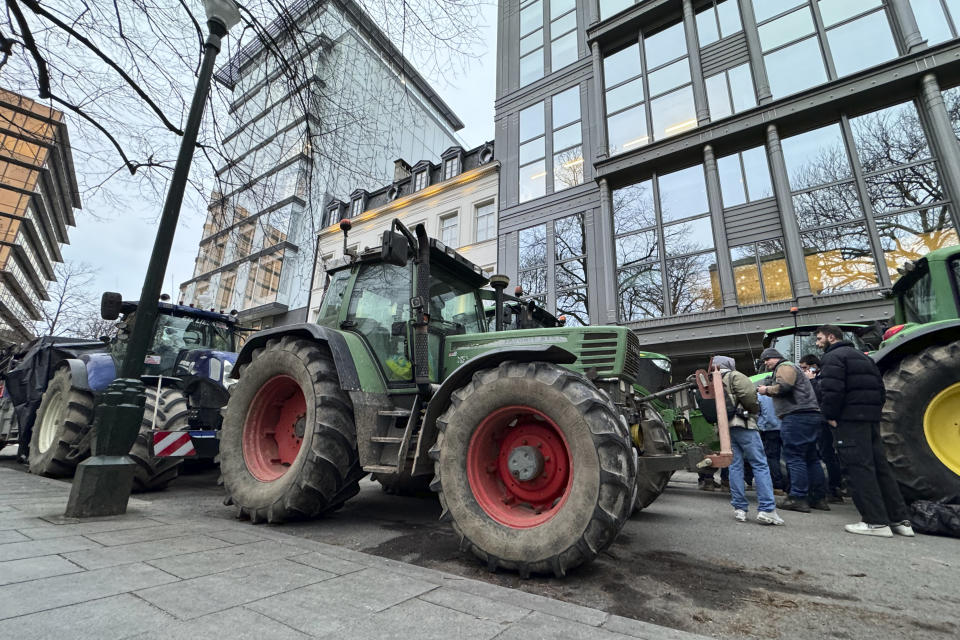 Farmers gather in the center of Brussels, Belgium, Wednesday, Jan. 31, 2024 ahead of a blockade Thursday. Farmers blocked more traffic arteries across Belgium on Wednesday as they sought to disrupt trade at major ports in a continued push for concessions to get better prices for their produce and less bureaucracy to do their work. The rallies, now in their fourth day and part of farming protests across the European Union, have seen only a few hundred tractors snarl traffic across the nation of 11.5 million. (AP Photo/Sylvain Plazy)