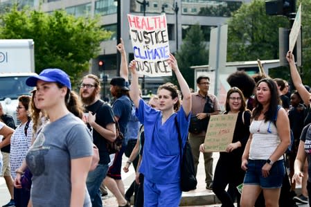 Climate change activists march down Connecticut Avenue in Washington