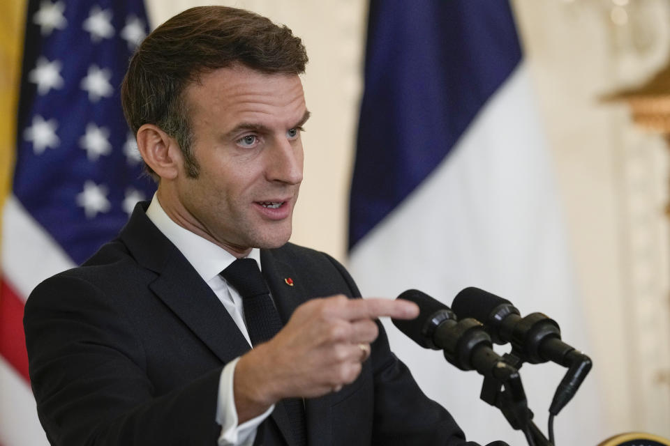 French President Emmanuel Macron speaks during a news conference with President Joe Biden in the East Room of the White House in Washington, Thursday, Dec. 1, 2022. (AP Photo/Susan Walsh)